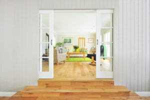 view of living room through sliding french doors with beautiful hardwood flooring